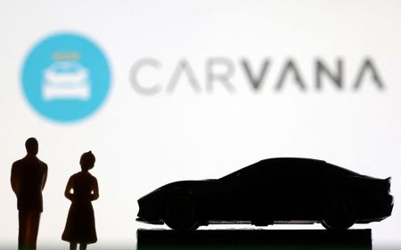 Carvana posts first-ever annual profit after it cuts debt, shares surge
